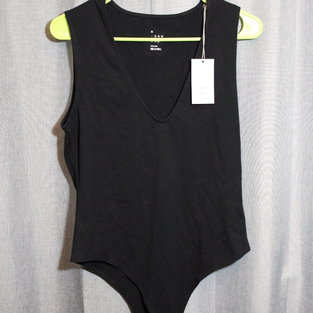 A new day, black body suit.
